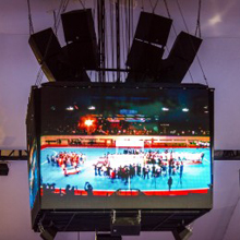 The main EVH arrays are flown above and around venue’s large four-sided central display; the EVF boxes are mounted underneath to serve as fills and address playing field